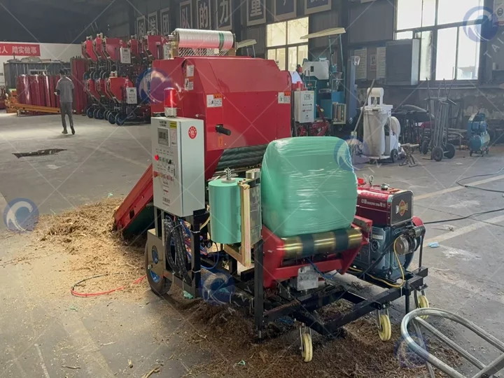 Round baler wrapper machine